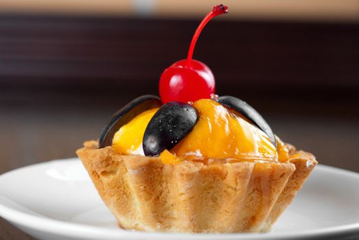 fresh baked cupcake closeup on a wooden table