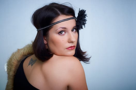 Retro portrait of a young woman in studio