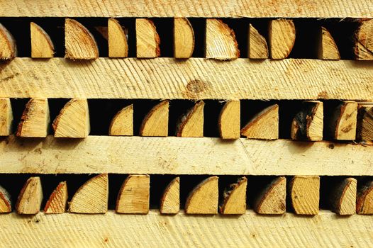 A stack of firewood cut into slices