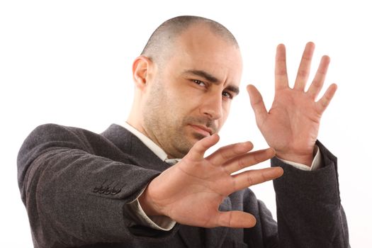 scared businessman on white background. Focus on the left hand 