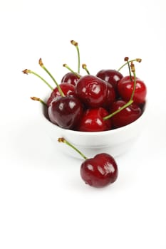 bunch of fresh cherries, shallow dof, over white