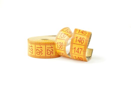 Curled measuring tape isolated on white