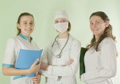 Three lady doctors staying indoors