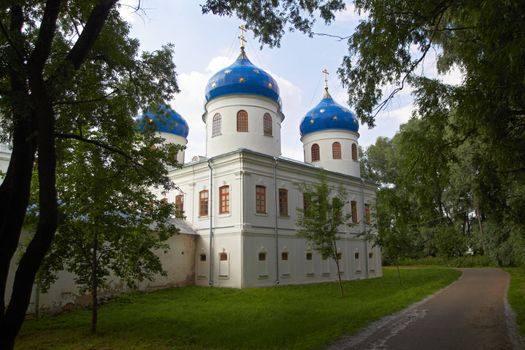 Russian Orthodox church of Juriev monastery in the trees. Novgoro, Russia