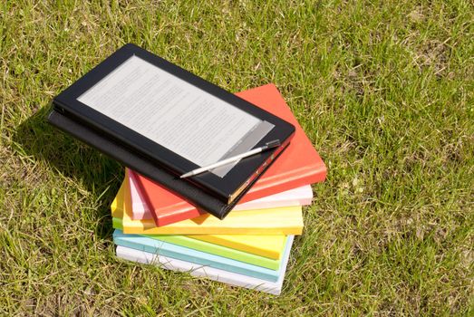 Ebook reader with a stack of books