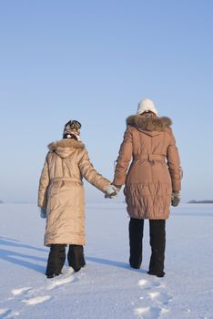 Two sisters go in the snow