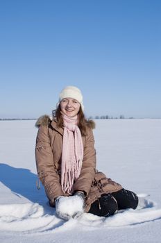 Teen girl playing with snow