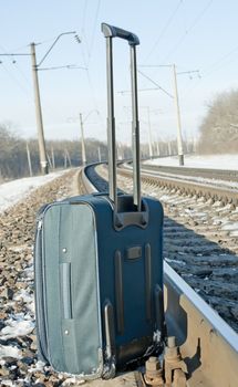 Suitcase near the railroad
