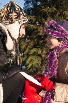 Girls looking into the bag with presents