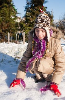 Girl playing with snow