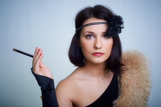 Retro portrait of a young woman in studio