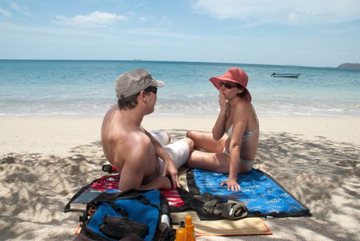 Good looking wife sends a kiss to her husband at a beach in Costa Rica