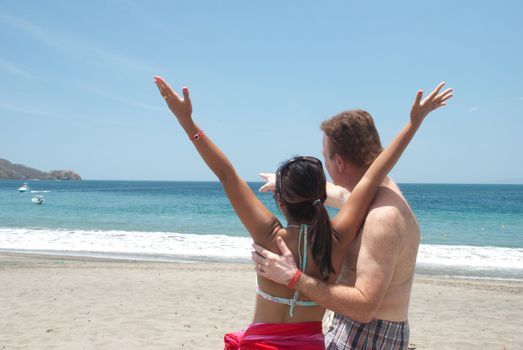 Couple enjoys the view at a beach in Costa Rica.