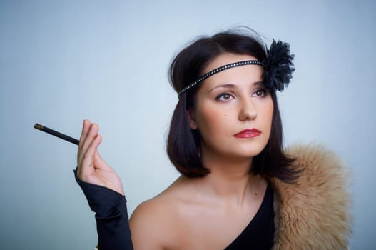 Retro portrait of a young woman in studio