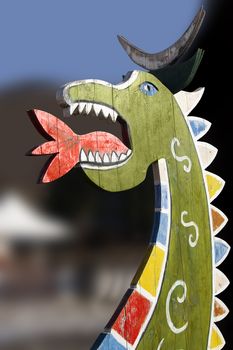 Colored dragon in wood, game for children