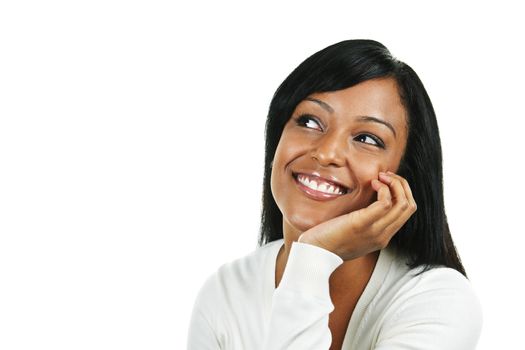 Smiling black woman looking up isolated on white background