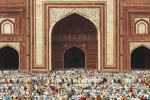 Thousands of people gather in front of the mosque at the Taj Mahal to celebrate the Muslim festival of Eid ul-Fitr in Agra, Uttar Pradesh, India