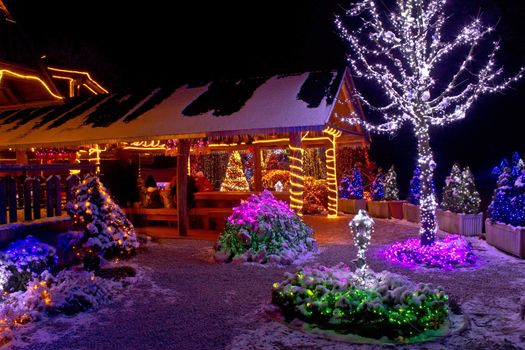 Christmas fantasy lodge and tree lights, Cazma, Croatia