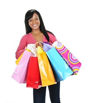 Young smiling black woman holding colorful shopping bags