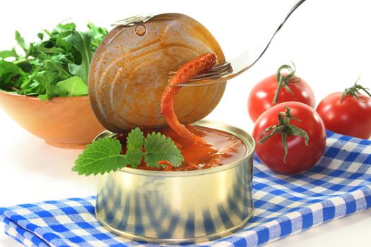 a tin of musk octopus in tomato sauce
