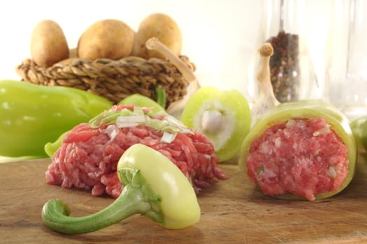 raw stuffed peppers with minced pork and onions