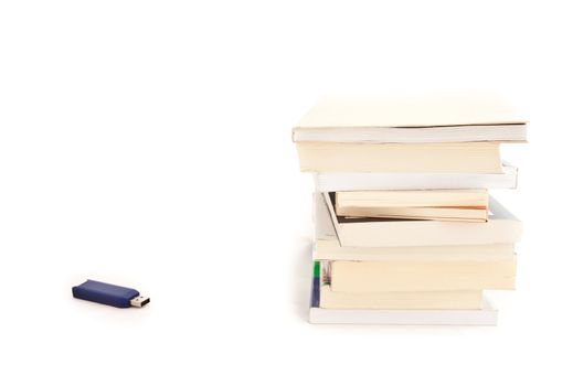 Concept of memories: blue usb key close to books