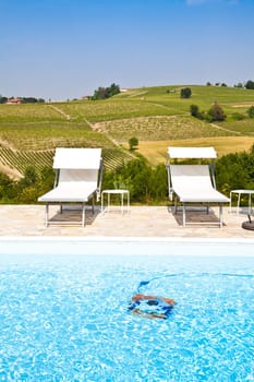 Swimming pool of an Italian beauty farm in the middle vineyards, Monferrato area, Piemonte region.