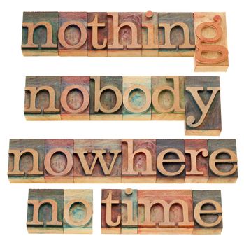 nothing, nobody, nowhere, no time - isolated words in vintage wood letterpress printing blocks