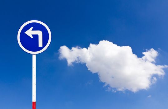 Curved Road Traffic Sign over blue sky,turn left