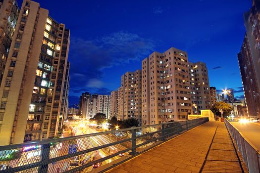 modern urban city at night with freeway traffic