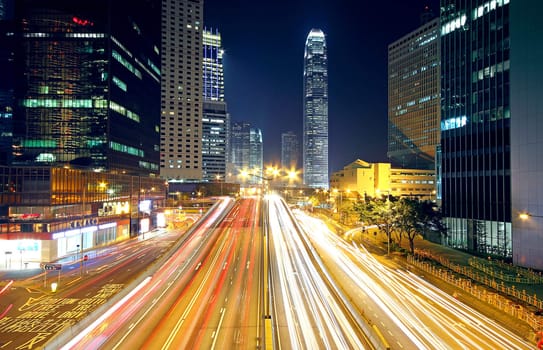 Colorful city night with lights of cars motion blurred in hong kong