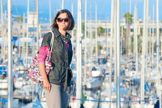 Closeup Portrait of beautifull womanin the background of yachts