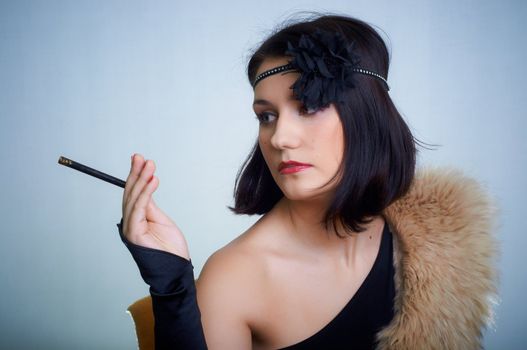 Retro portrait of a young woman in studio