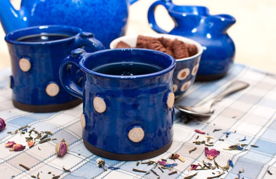 Breakfast - Tee and Coffee in Blue Mugs on the Table