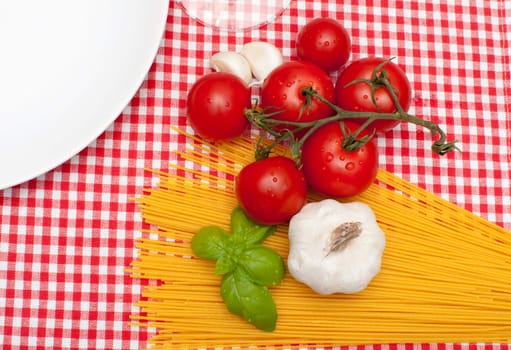 Spaghetti, Garlic, Basil and Tomatoes on Table