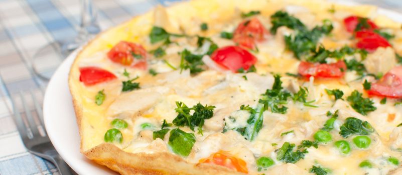 Omelette With Tomatoes, Parsley, Peas and Cheese