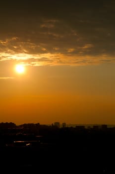 Sunset over Silhouette of City LIne