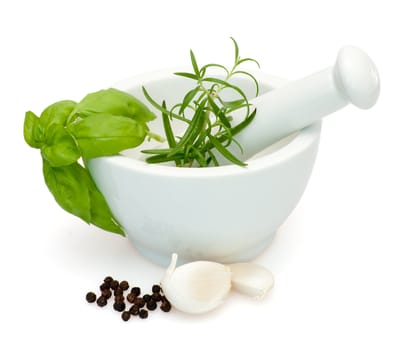 Preparation of marinade in Mortar - Salt, Rosemary, basil, garlic and pepper - with clipping path