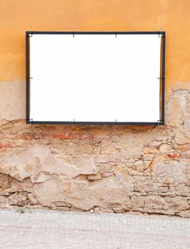 Empty Frame on the aged destroyed wall in the street