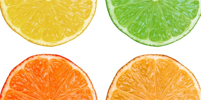 Slices of lemon lime orange citrus fruit isolated on white