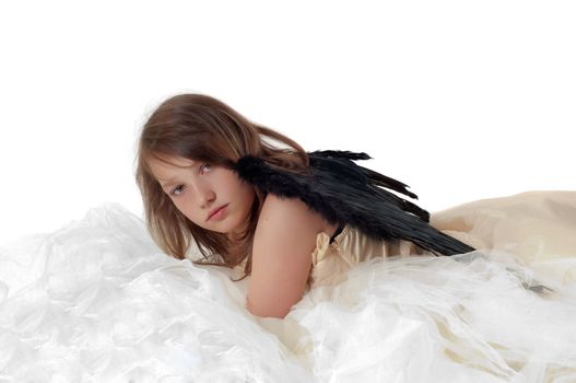 Teenager girl with wings in studio isolated on white