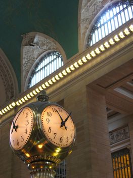 The old clock in the center of grand central station in New York City.