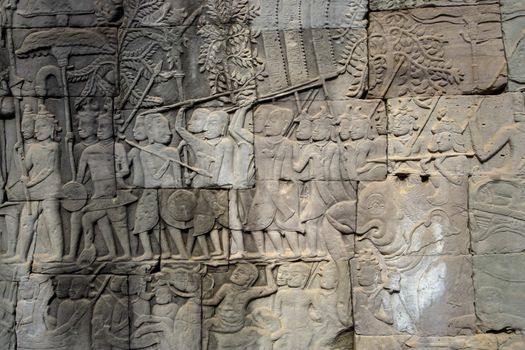 A carved wall of the Angkor temples in Siem Reap, Cambodia.
