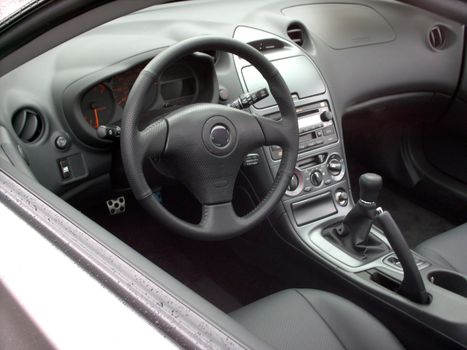 An interior of a brand new sports car.
