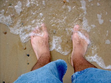 The ocean is washing ashore on my piggie toes.
