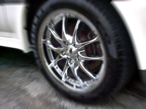 closeup of a chrome rim with zoom blur effect