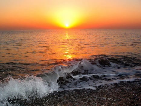 Sea wave at a beautiful sunset