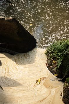 Pollution seeping into a stream