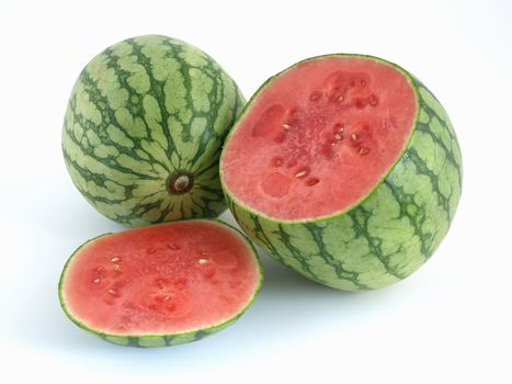 Juicy ripe cut watermelon with a whole melon studio isolated over a white background.