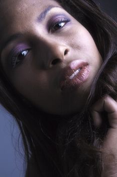 A beauty portrait taken from an african model in the studio being sensual